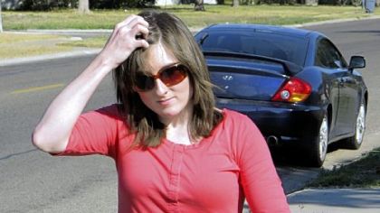 Hillary Adams walks outside her mother's home in Portland, Texas, on Wednesday.