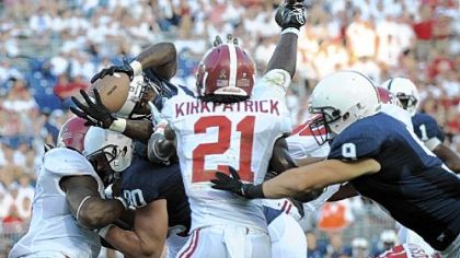 Silas Redd stretches through two Alabama defenders to score the Nittany Lions' only touchdown.
