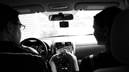 The Chiado-Knieling family sticks to a strict household budget. Eric Chiado gives his daughter Chloe, 15, a $10 bill to spend at Panera Bread with her friends.