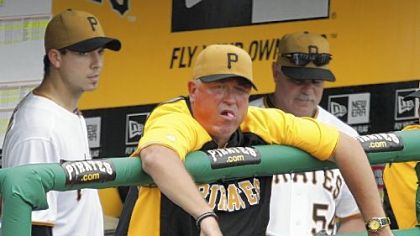 Pirates manager Clint Hurdle, center, starting pitcher Charlie Morton, left,  and pitching coach Ray Searage watch from the dugout during the bottom of the seventh inning Wednesday against the St. Louis Cardinals at PNC Park.