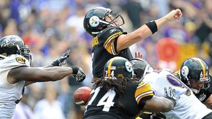 Ravens linebacker Terrell Suggs knocks the ball out of quarterback Ben Roethlisberger's hands before he has a chance to throw a pass in the fourth quarter of the Steelers' season-opening loss.