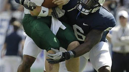 Penn State linebackers Gerald Hodges, right, and Khairi Fortt tackle Eastern Michigan quarterback Alex Gillett in the first half Saturday at Beaver Stadium. The Nittany Lions sacked Gillett three times in the first half.