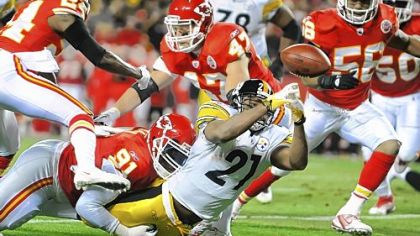 Mewelde Moore fumbles the ball in the first quarter as he stretches for the goal line. The Chiefs recovered in the end zone, negating the Steelers' first scoring chance of the night.