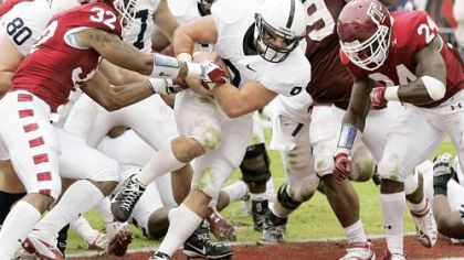 Michael Zordich, center, bulls into the end zone with the go-ahead touchdown as Penn State rallied for a 14-10 win against Temple Saturday in Philadelphia.