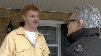 Penn State assistant football coach Mike McQueary, left, speaks to CBS News correspondent Armen Keteyian on Tuesday. Mr. McQueary is cited by a grand jury report as witnessing Jerry Sandusky sodomizing a 10-year-old boy in a Penn State locker room in 2002.