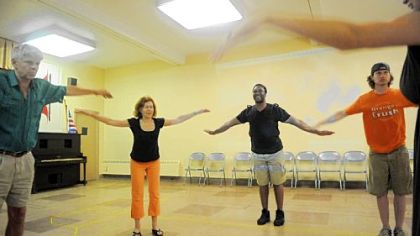 From left, Chrisopher Josephs, Thalia Snyder, Monteze Freeland and Eric Anderson warm up before rehearsing a flying scene from "Camino."