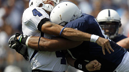 Penn State's Jordan Hill hits Indiana State quarterback Ronnie Fouch as he releases a pass.