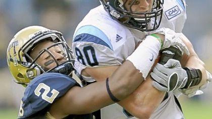 Pitt's K'Waun Williams tackles Maine's Derek Buttles.
