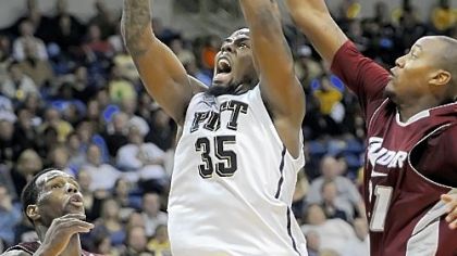 Pitt's Nasir Robinson drives to the basket between Rider's Novar Gadson and Brandon Penn in the second half Sunday night at the Petersen Events Center.