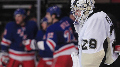 Penguins goalie Marc-Andre Fleury  reacts after New York Rangers center John Mitchell scored a goal.