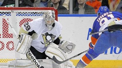 Penguins goalie Marc-Andre Fleury stops a shot by New York's John Tavares -- one of the 33 saves he made en route to his 20th career shutout in the Penguins' 3-0 victory Tuesday in Uniondale, N.Y.