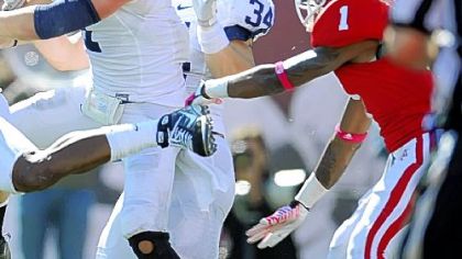 Indiana wide receiver Shane Wynn, right, can't come down with a last-second pass as Penn State's Nathan Stupar, center, defends the pass during a game earlier this season.
