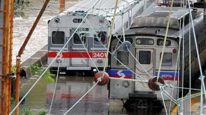 Two Southeastern Pennsylvania Transportation Authority trains sit in water on flooded tracks at Trenton train station on Sunday, in Trenton, N.J.