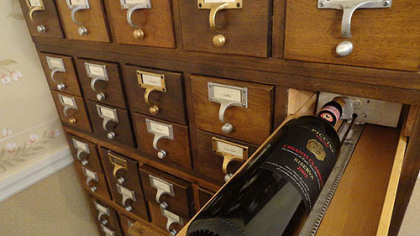 Mara O'Neill of Fox Chapel repurposed old card catalog cabinets as a wine rack and holder of USB cables, phone cords and other electronic accessories.