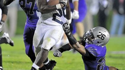 Penn State's Silas Redd breaks a tackle by Northwestern's Jordan Mabin Saturday. Redd finshed with 164 yards -- his fourth consecutive 100-yard game in the Nittany Lions' 34-24 win.