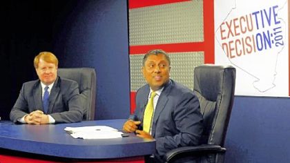 Rich Fitzgerald (left) and D. Raja during a break in the Allegheny County executive debate Thursday at Robert Morris University.